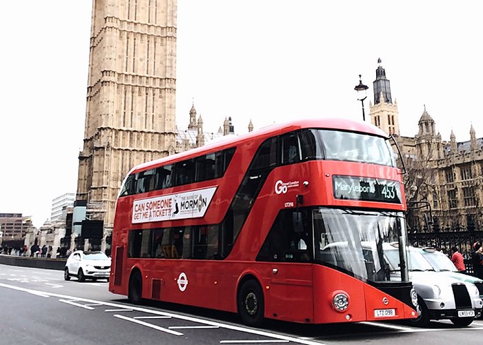 red colored double decker bus